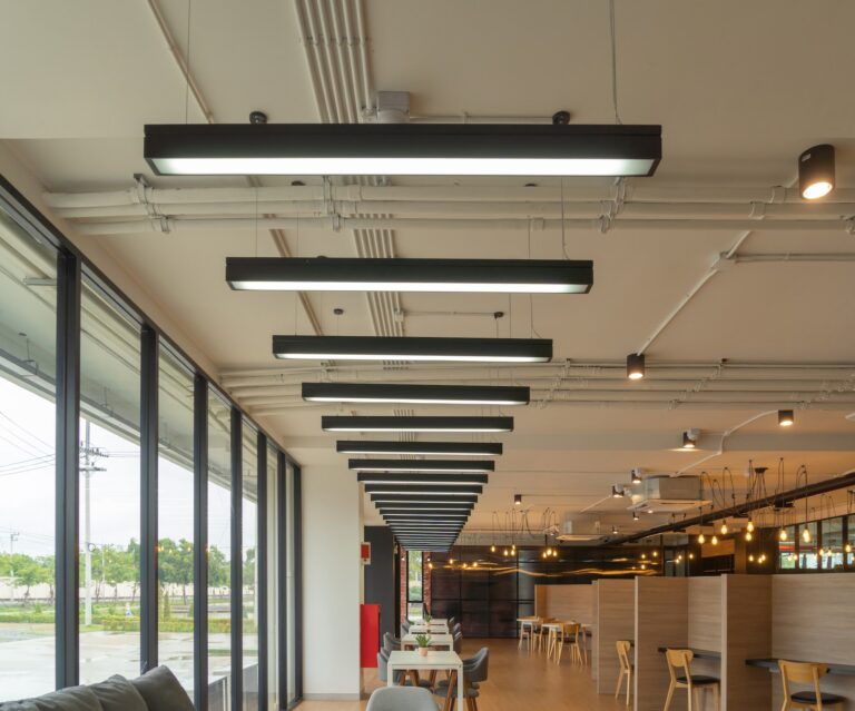 Modern simple and ceiling lamp decoration in meeting room. Lighting strips. Office building.